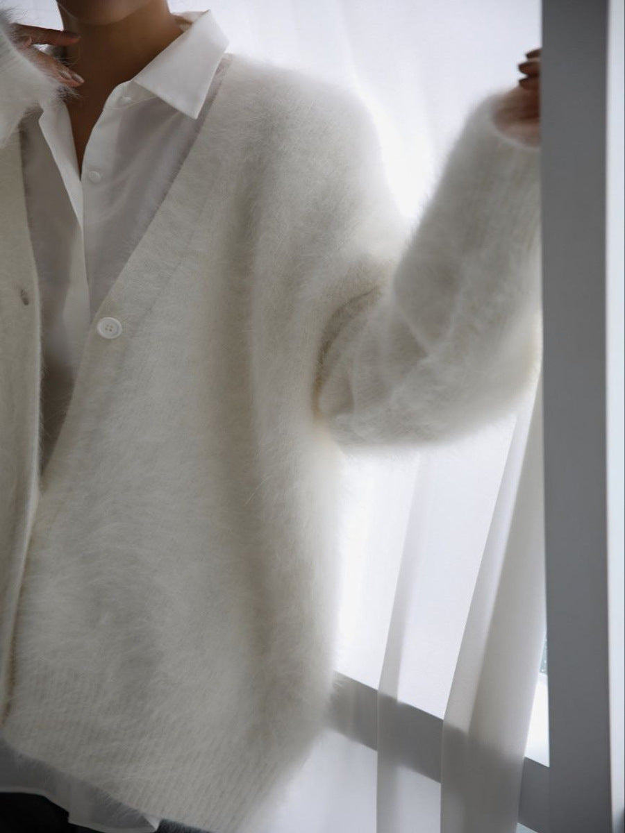 Model posing in a women's oversized faux cashmere cardigan, showcasing its elegant drape
