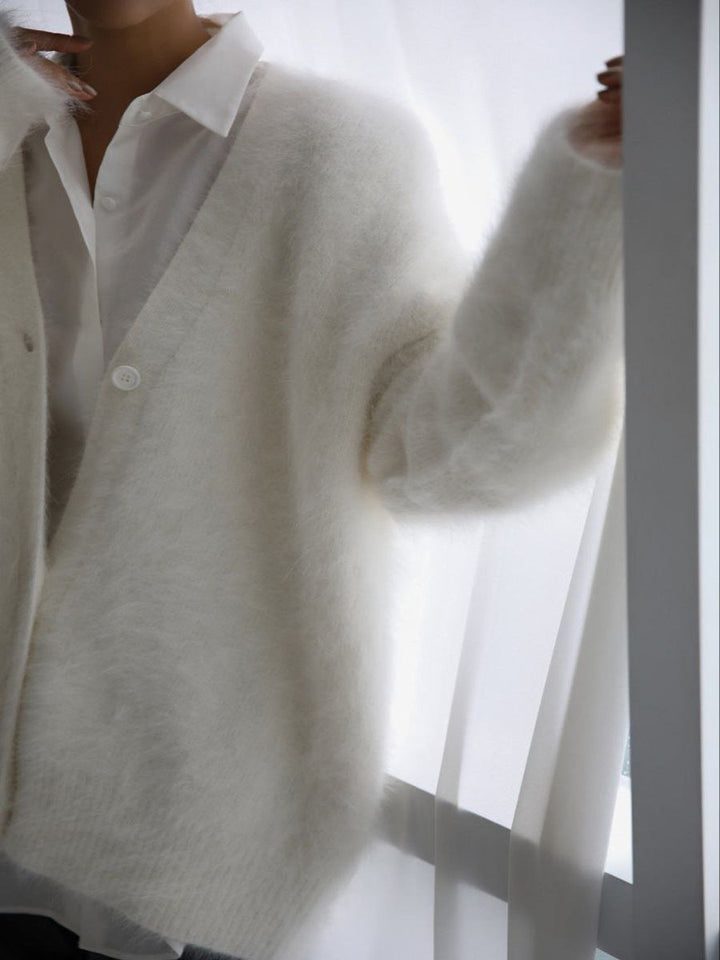 Model posing in a women's oversized faux cashmere cardigan, showcasing its elegant drape
