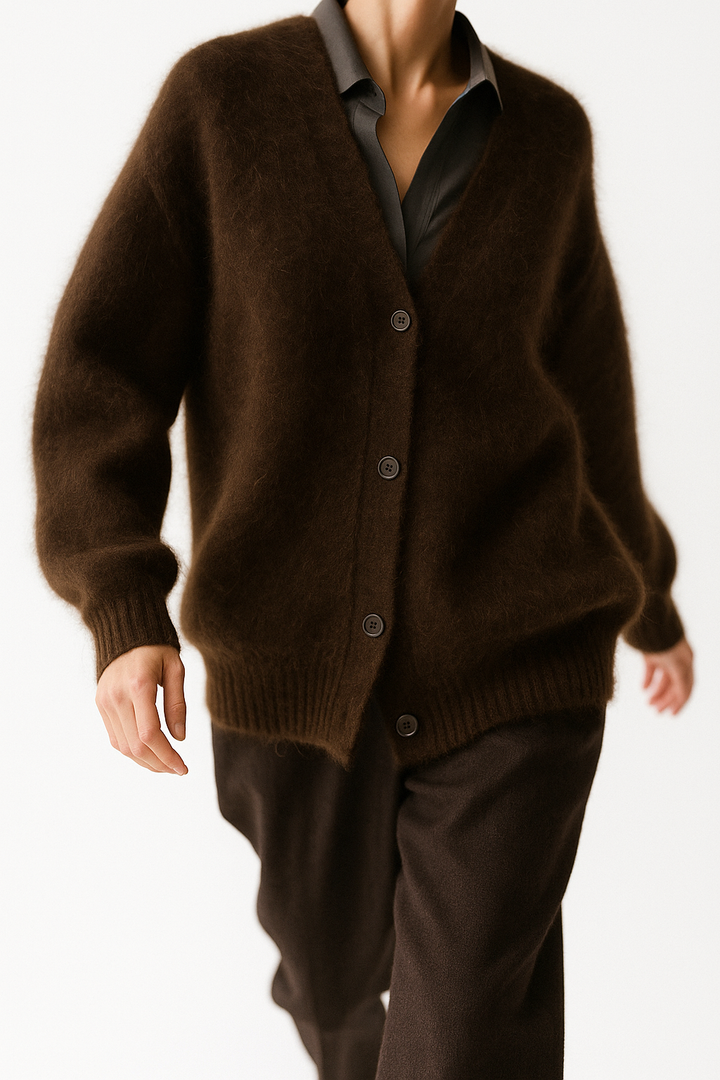Overhead shot of a soft women's oversized cardigan, highlighting its plush texture