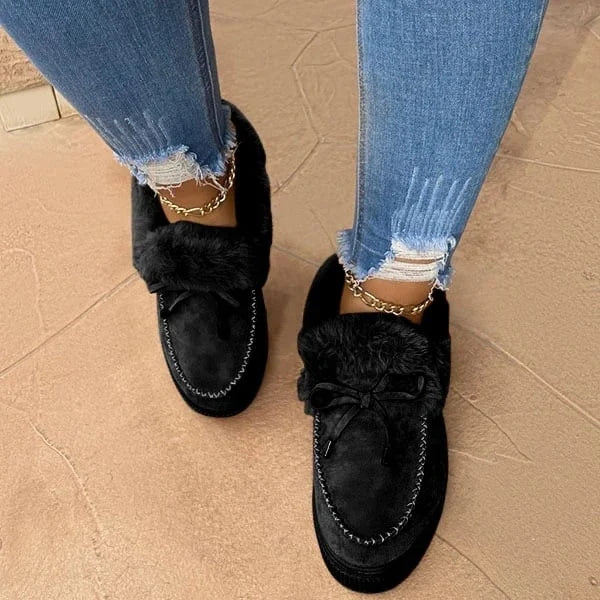 Warm & cozy women's slip-on shoes with a round toe design, perfect for comfortable winter footwear.