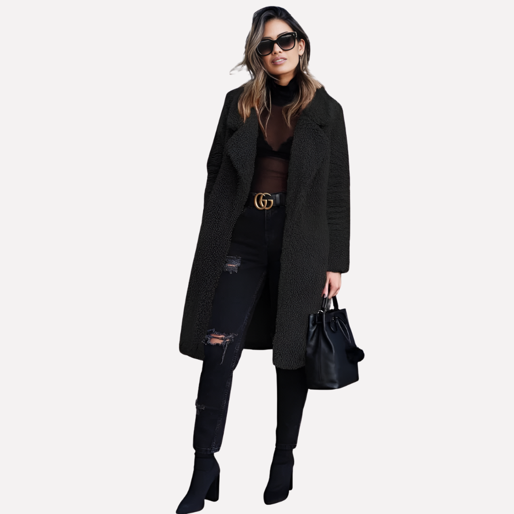 Fashionable women's cozy longline teddy coat. Chic relaxed fit winter outerwear for a stylish fall look.