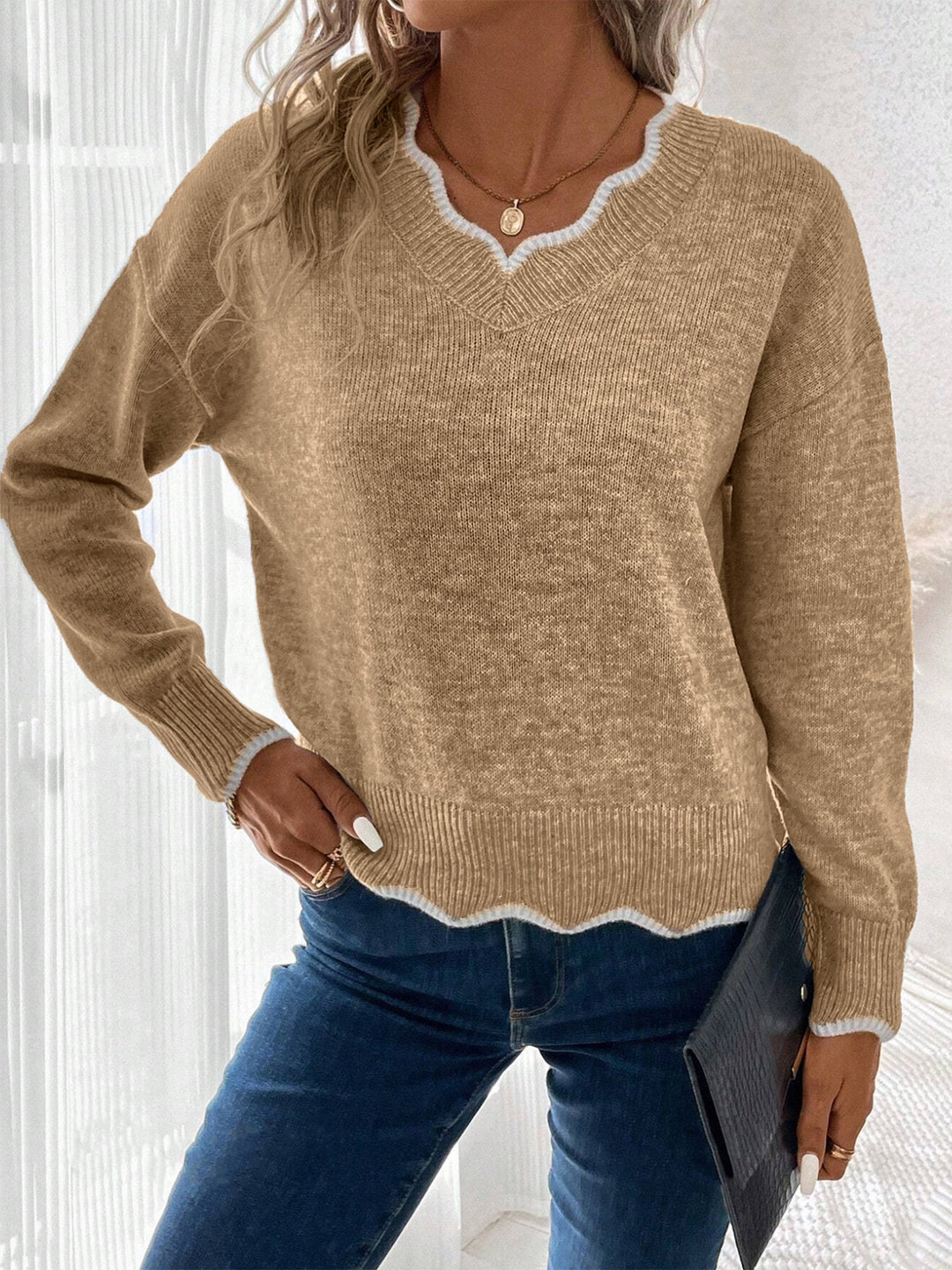 Relaxed fit women's long sleeve pullover, cozy and comfortable with a unique notch V-neck.