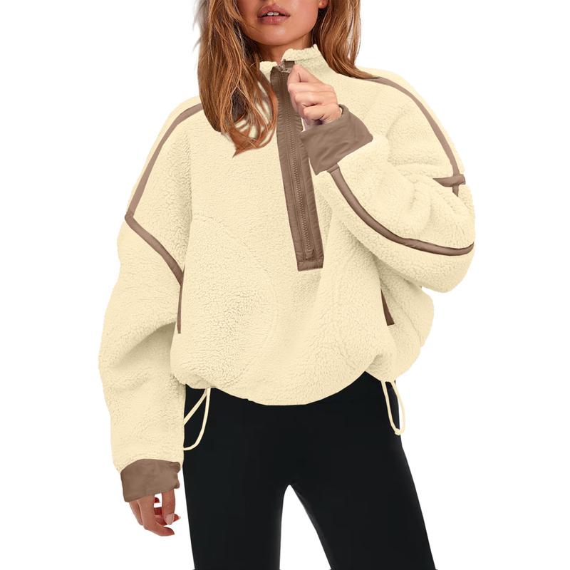 Close-up of the soft, fleecy texture of a women's sherpa half-zip pullover, ideal for cozy wear.