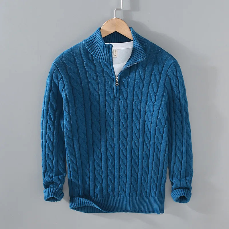 Woman wearing a stylish half-zip cable knit sweater, showcasing its comfortable and casual fit.