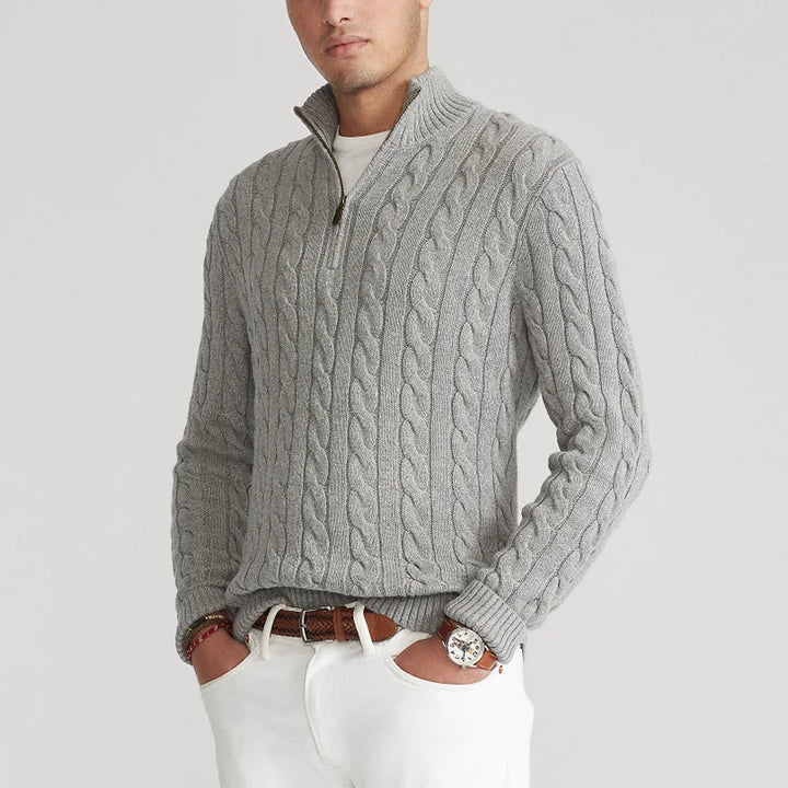 Women's cream half-zip cable knit sweater styled with jeans, a classic and versatile knitwear look.