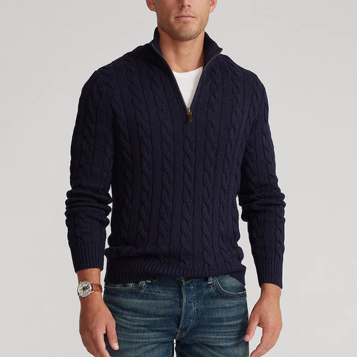 Folded women's half-zip cable knit sweater, highlighting its quality and cozy texture.