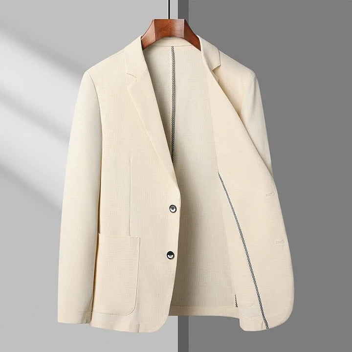 Women's cream tailored blazer, lightweight & elegant, perfect for professional wear or business casual outfits