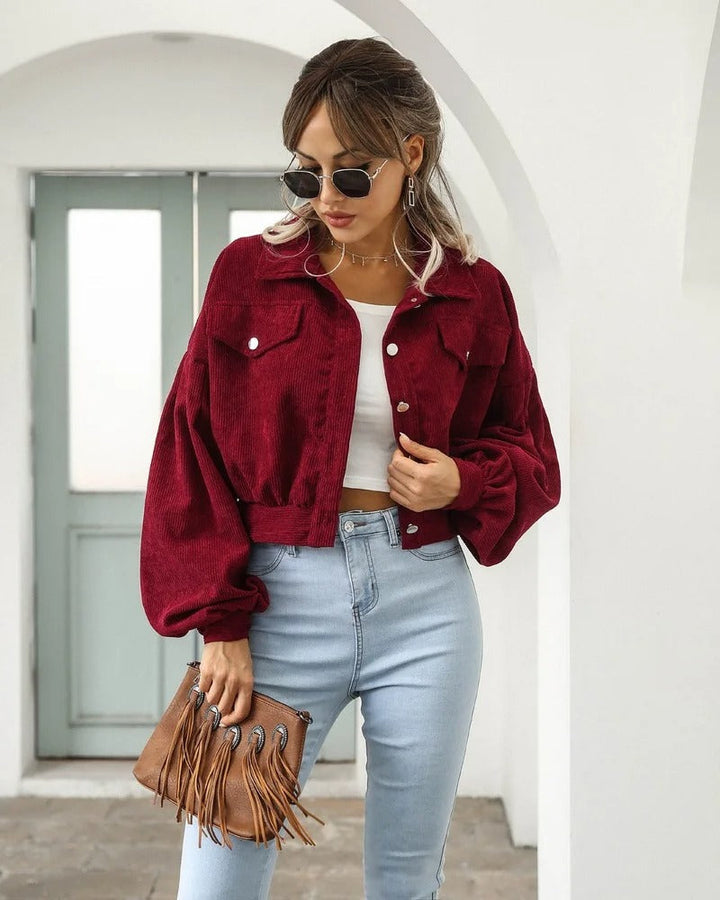 Stylish women's short denim jacket with puffed sleeves & button-front, ideal for casual summer fashion.