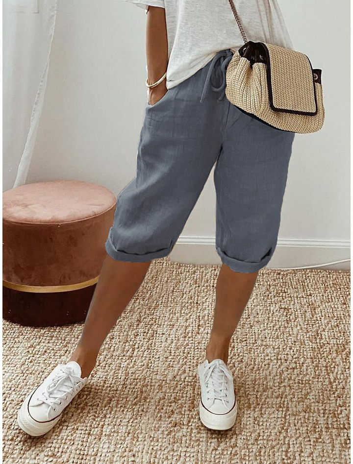Relaxed fit women's cropped shorts with elastic waist. Straight leg pull-on design, perfect for comfortable summer fashion.