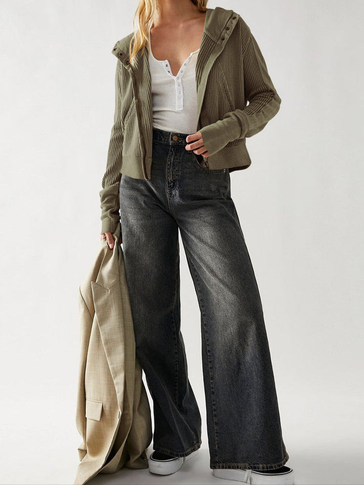 Woman zipping up her comfortable cropped waffle-knit hoodie, casual daily wear
