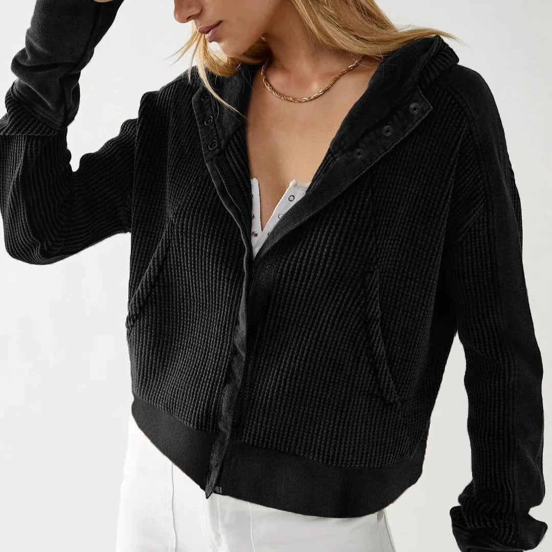 Texture swatch of the waffle-knit fabric from the women's cropped zip hoodie, cotton