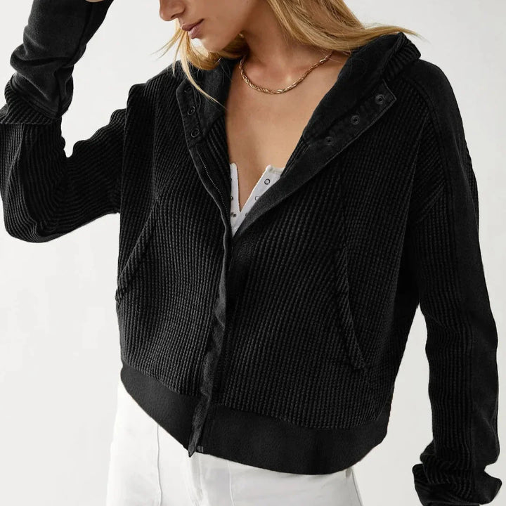Texture swatch of the waffle-knit fabric from the women's cropped zip hoodie, cotton