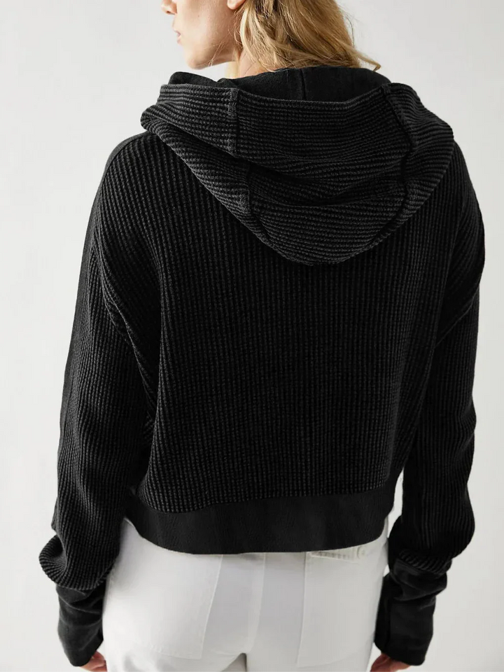 Women's cropped waffle-knit zip hoodie in a vibrant blue, expressive casual wear