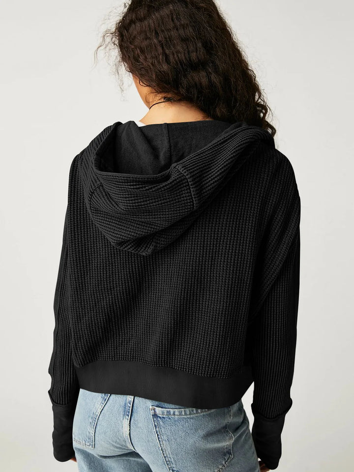 Mannequin showcasing a women's cropped waffle-knit zip hoodie, retail display