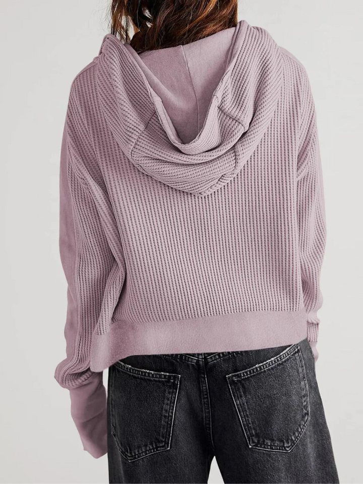 Detail photo of the internal stitching of a women's cropped waffle-knit zip hoodie