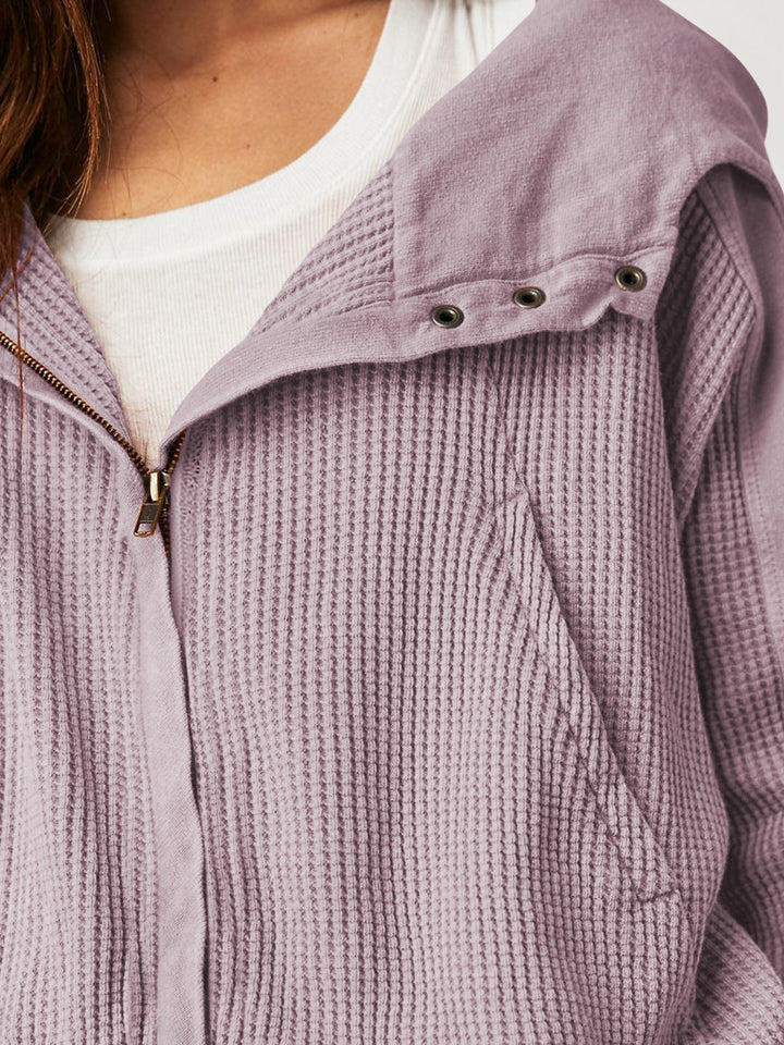 Women's cropped waffle-knit zip hoodie with hood up, cozy and inviting loungewear