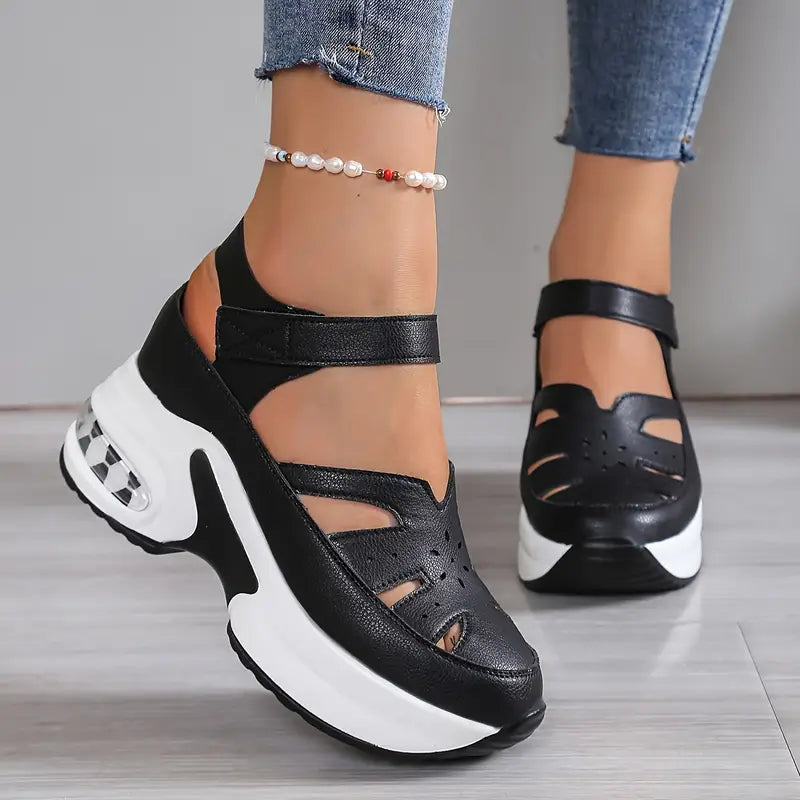 Cushioned women's platform wedge sandals with breathable cutouts, adjustable strap, perfect for comfortable walking.