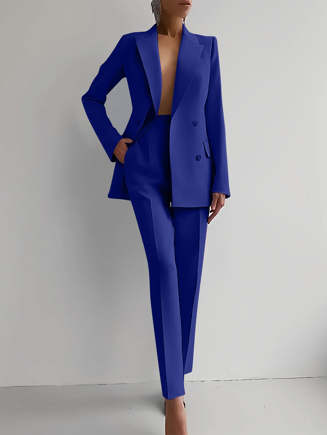 Classic black women's double-breasted blazer & slim trousers suit set. Professional office wear.