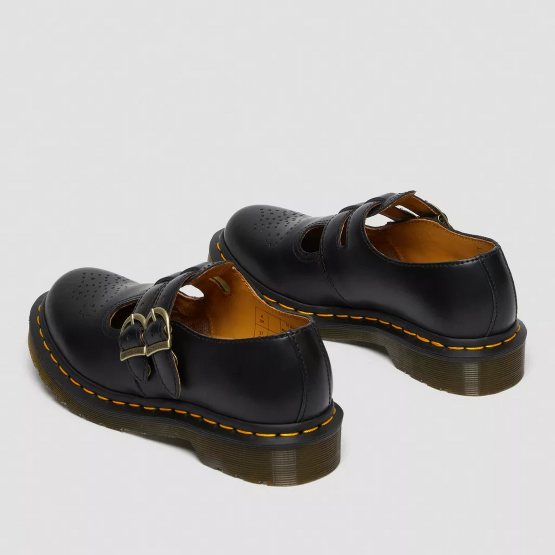 Side view of black double buckle Mary Janes, women's flat shoes for comfortable everyday wear.