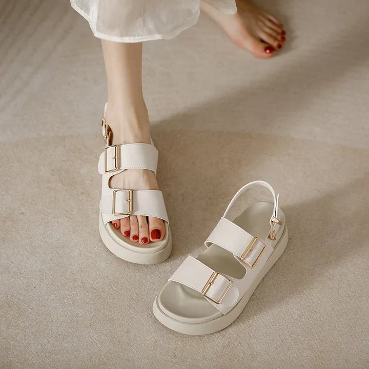 Trendy women's double buckle platform sandals in black, made from durable vegan leather