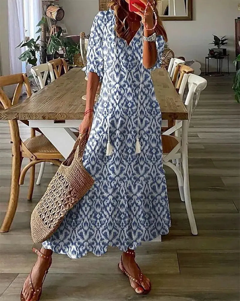 Women's effortless boho A-line dress with flattering fit, long sleeves, and vibrant geometric print, perfect for summer.