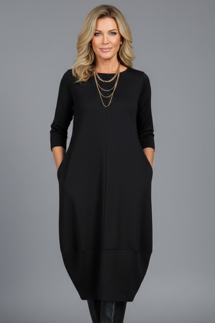 Effortless women's midi dress, A-line style with a round neck and three-quarter sleeves. Includes pockets.
