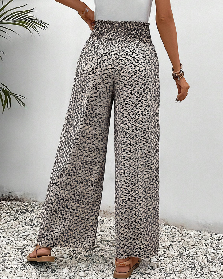 Stylish women's wide-leg pants with elastic waist, offering a flowy, relaxed fit for casual chic outfits.
