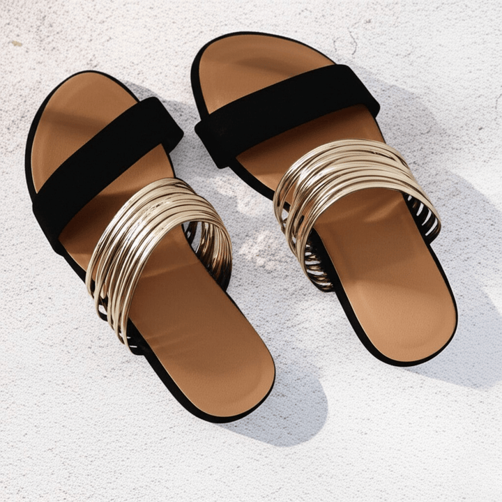 Vacation-ready women's flat slip-on sandals. Lightweight & comfortable for summer adventures.