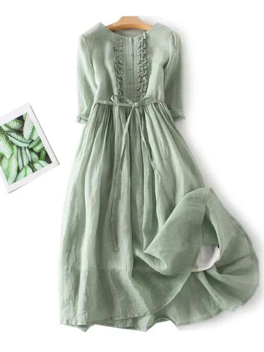 New women's effortless summer dress, highlighting its airy fabric and stylish, comfortable design.