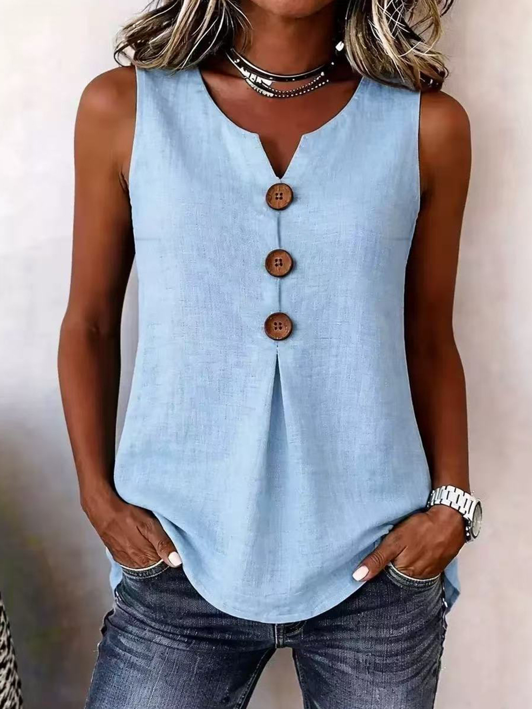 Women's Effortless V-neck sleeveless blouse with elegant pleated front. Perfect loose-fit top for spring & summer style.