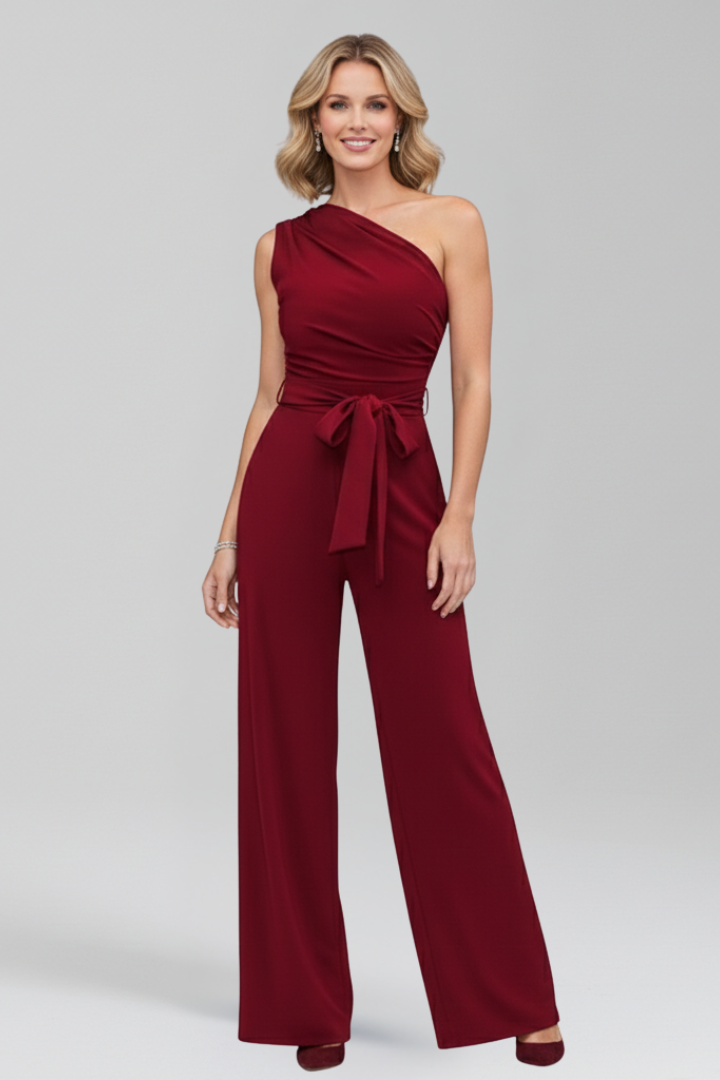 Asymmetric neckline women's jumpsuit with wide legs and a belted waist, offering a chic and comfortable fit.