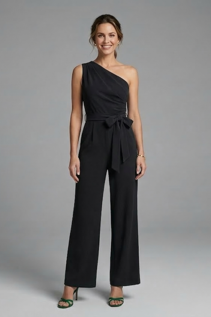 Comfortable elegant women's jumpsuit, sleeveless, with an asymmetric neckline, wide leg, and defining waist belt.