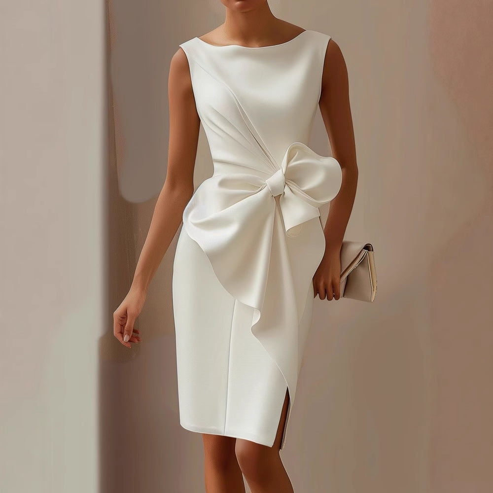 Women's elegant asymmetric sleeveless dress, perfect for cocktails or wedding guests. Features a chic bow detail.