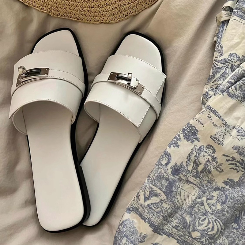 Women's elegant black leather square toe slides with metallic buckle, perfect for summer casual wear.