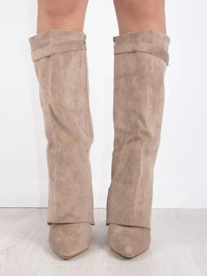 Winter wear: chic brown pointed toe knee-high boots for women, featuring an elegant wedge heel.