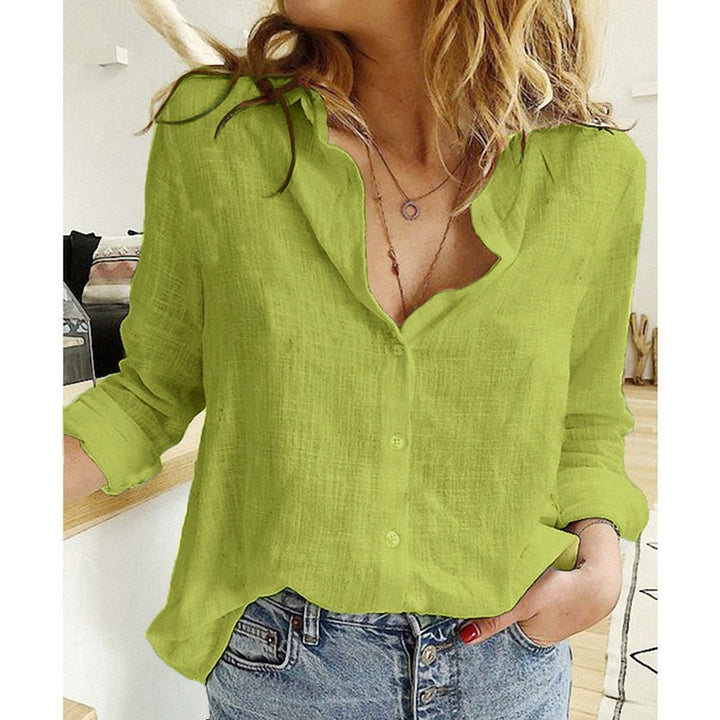 Comfortable long-sleeve women's blouse with elegant bird print. Relaxed fit, ideal for spring style.
