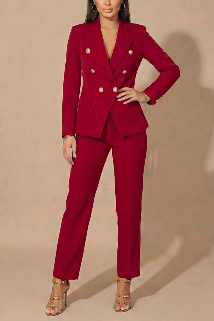 Elegant women's power suit, a double-breasted blazer and tailored trousers, ideal for formal wear.