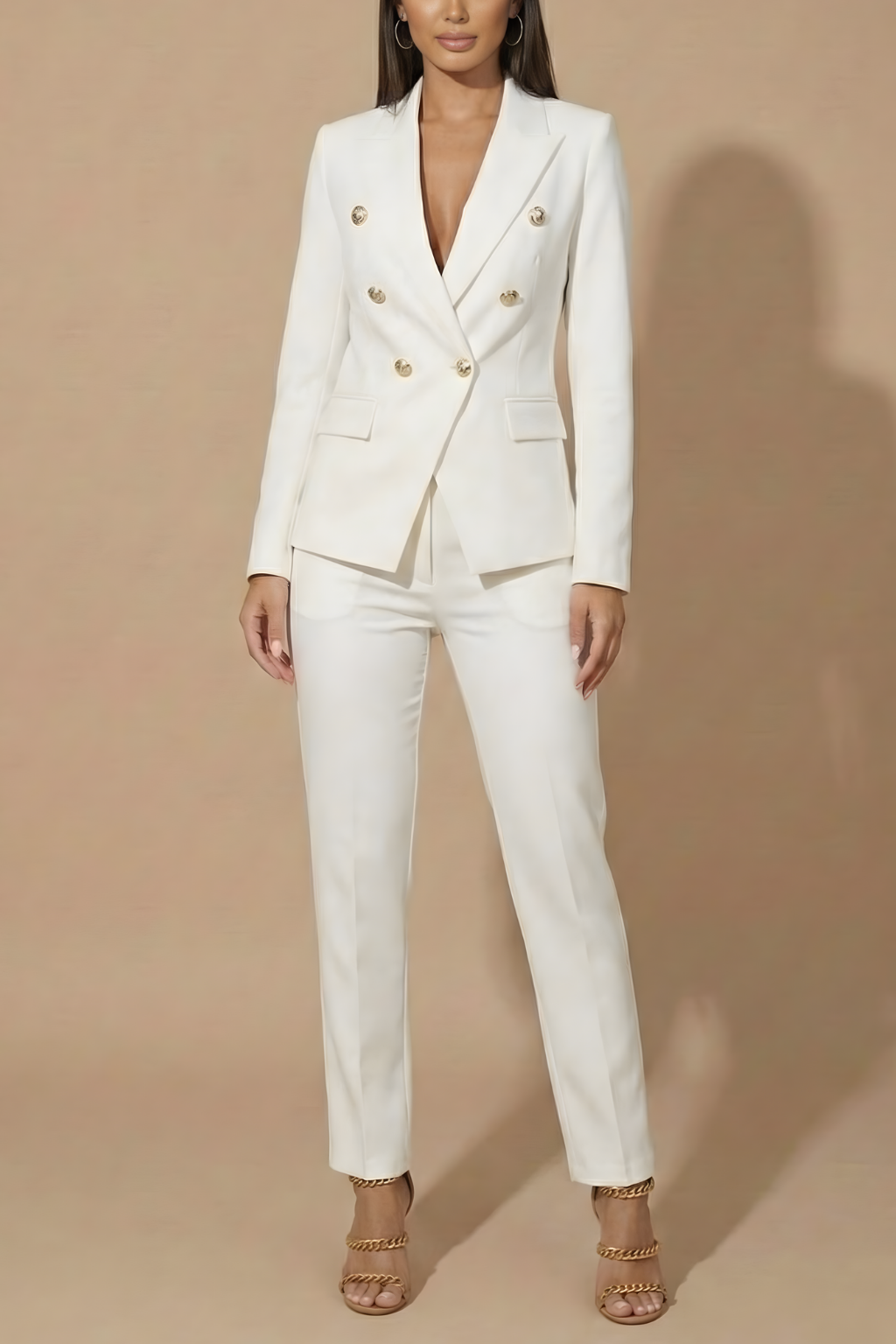 Sophisticated women's double-breasted blazer and tailored trouser set, a must-have for professional fashion.