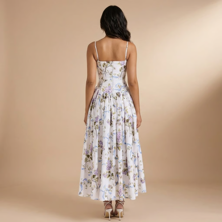 Elegant floral midi dress for women, featuring a corset style top; ideal wedding guest or cocktail attire.