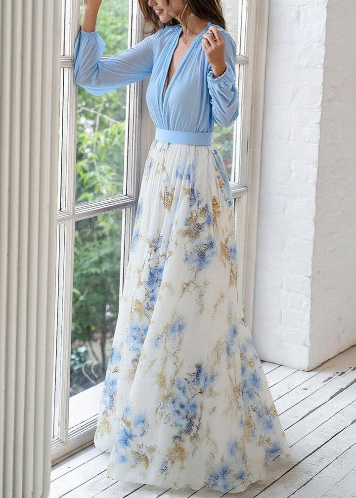 Flowy women's printed floral maxi dress featuring a chic deep V-neck and long sleeves for versatile styling.