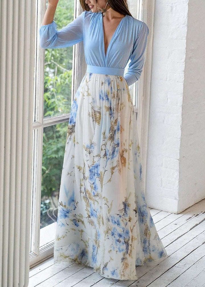 Beautiful women's floral maxi dress with a deep V-neckline and long sleeves, ideal for comfortable elegant wear.