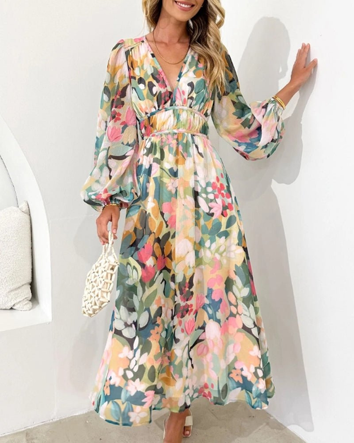 Beautiful women's floral print midi dress featuring stylish puff sleeves & a flattering V-neckline. Ideal for events.