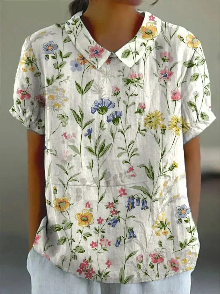 Chic women's floral print blouse, a versatile elegant top for casual or everyday wear.