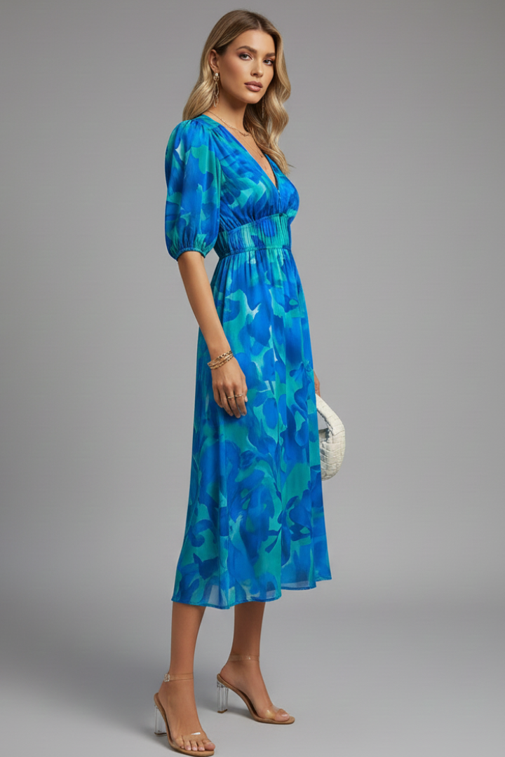 Vibrant floral print midi dress for women, with elegant puff sleeves & an elastic waist, ideal for summer fashion.