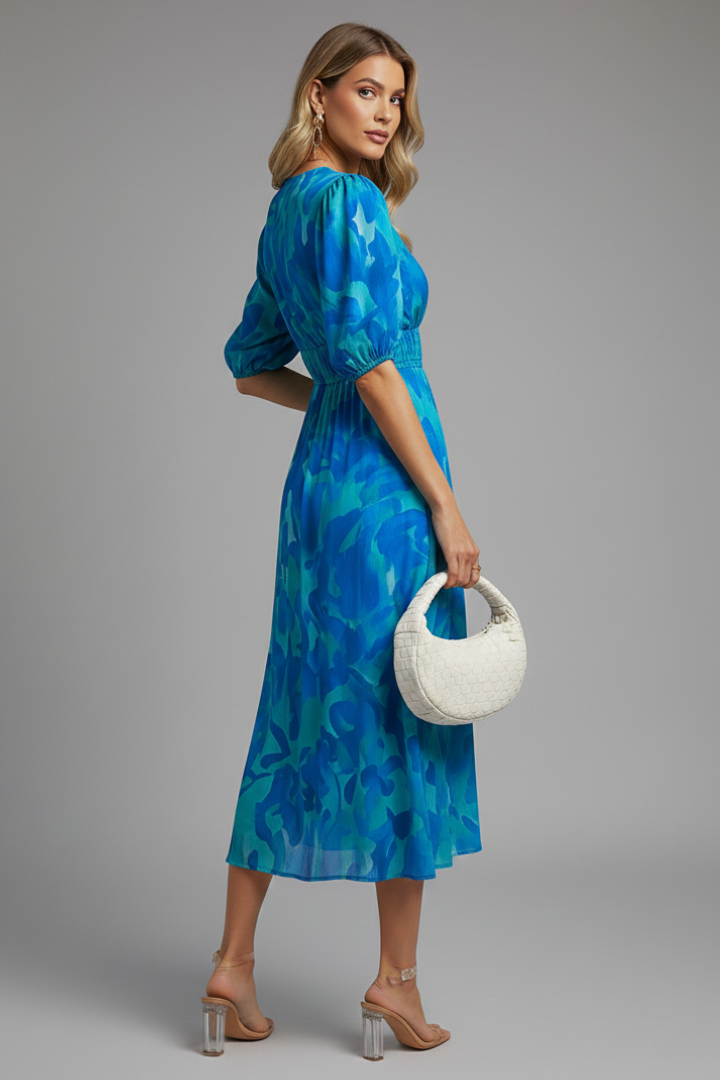 Women's comfortable floral midi dress with elastic waist, stylish puff sleeves, and a flattering V-neck design.