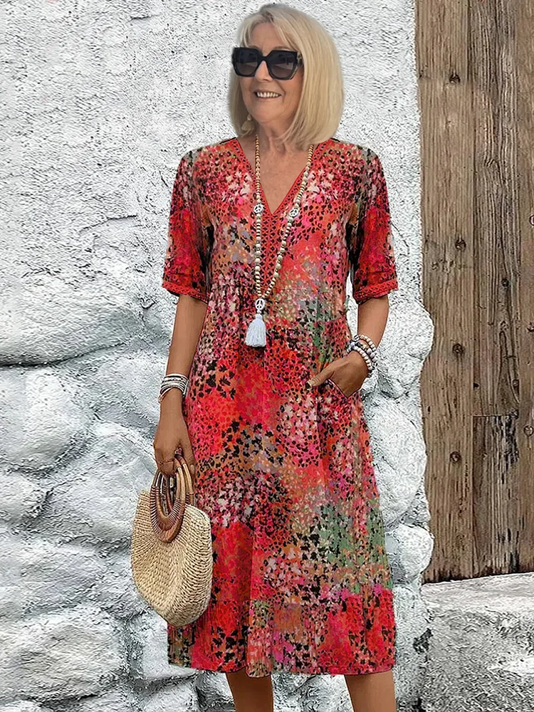Stylish women's V-neck midi dress featuring a vibrant floral print. Ideal casual or elegant summer A-line fashion.