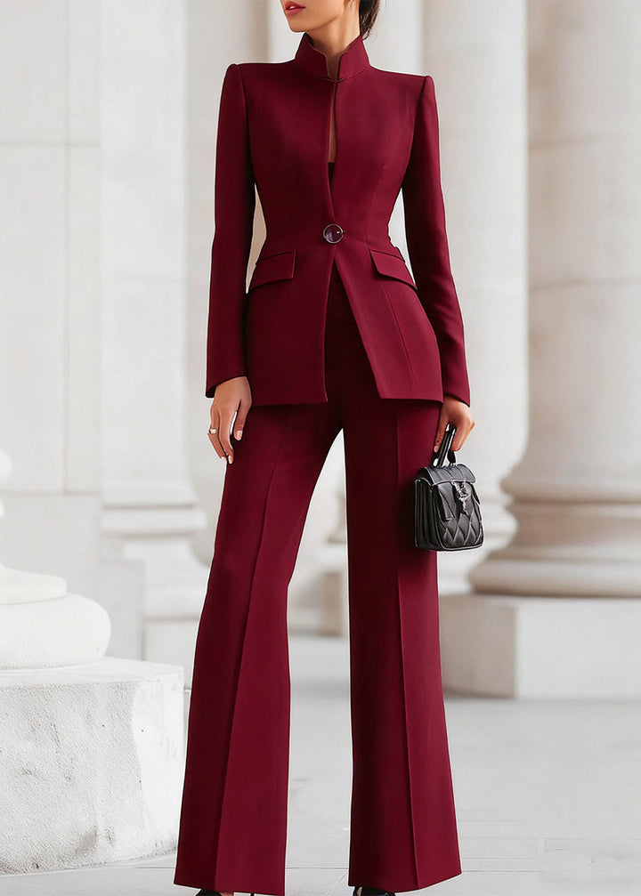 Formal women's trouser suit with high-collar blazer and wide-leg pants for power dressing.
