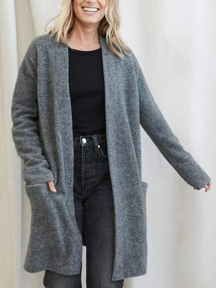 Close-up of a women's knit cardigan, showcasing the soft texture of the merino blend fabric