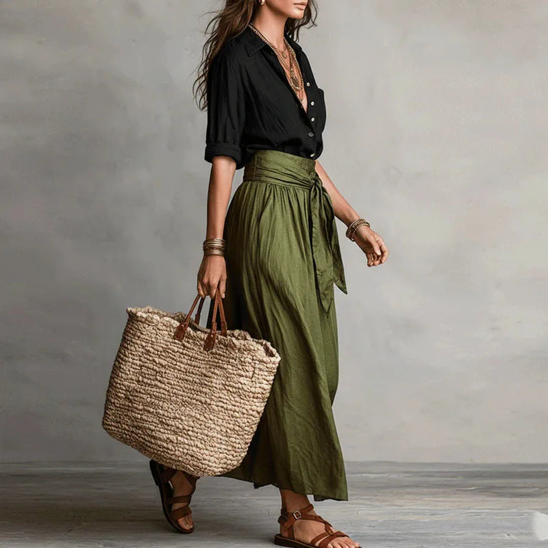 Two-piece women's linen set, featuring a stylish blouse and a matching skirt, perfect for summer elegance.