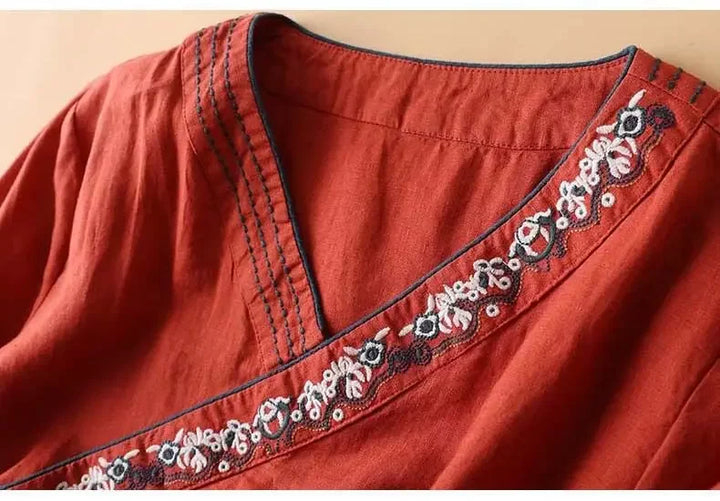 Stylish women's blouse, patterned, relaxed fit, V-neck. Elegant design for versatile styling.